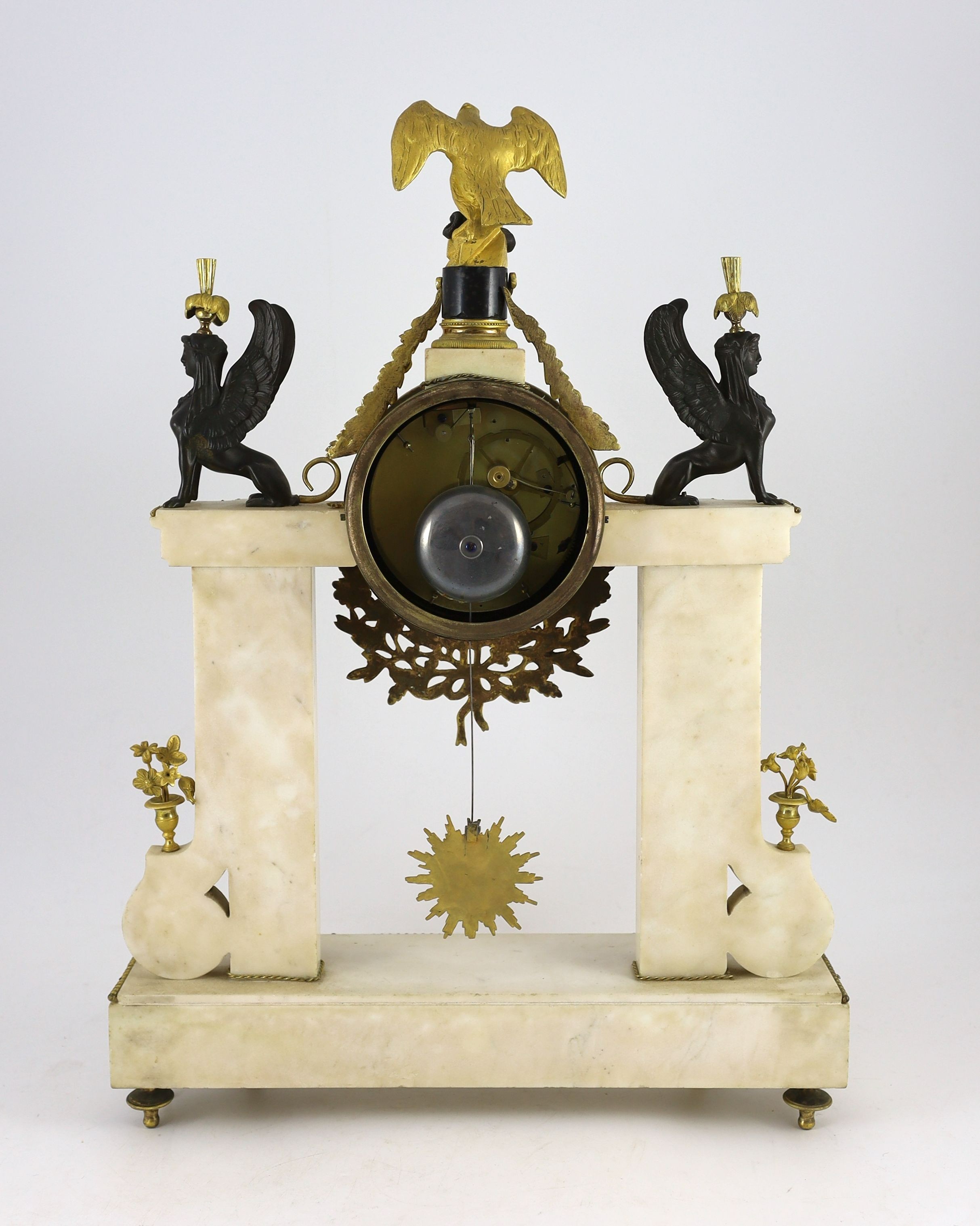 Jean Baptiste Dubuc L'ne à Paris. A Louis XVI bronze and ormolu mounted white marble mantel clock, width 43cm, depth 11cm, height 60cm